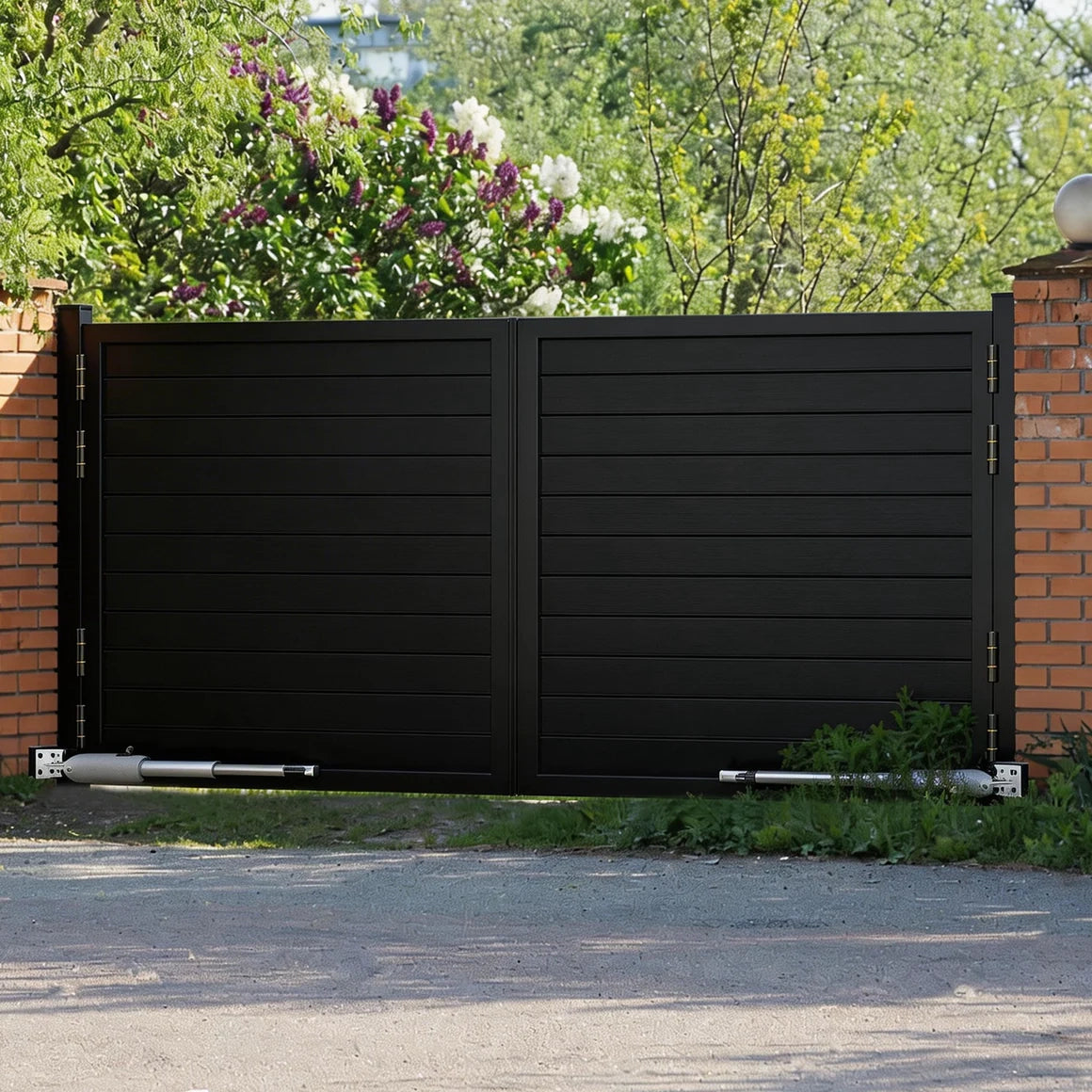 Heavy duty automatic black driveway gate seamlessly operating on a suburban residential street.