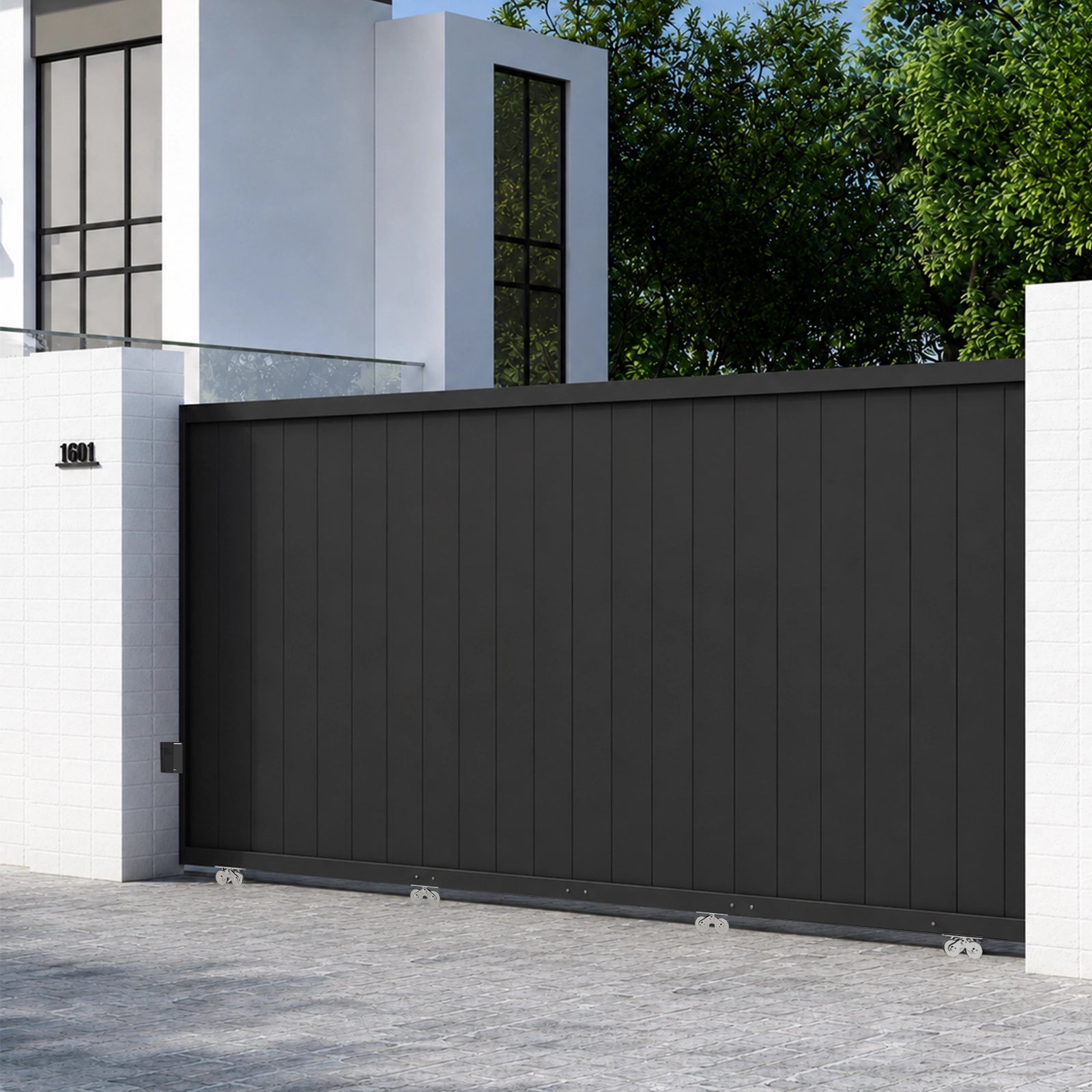 Black aluminum sliding track gate smoothly opening along perimeter wall.