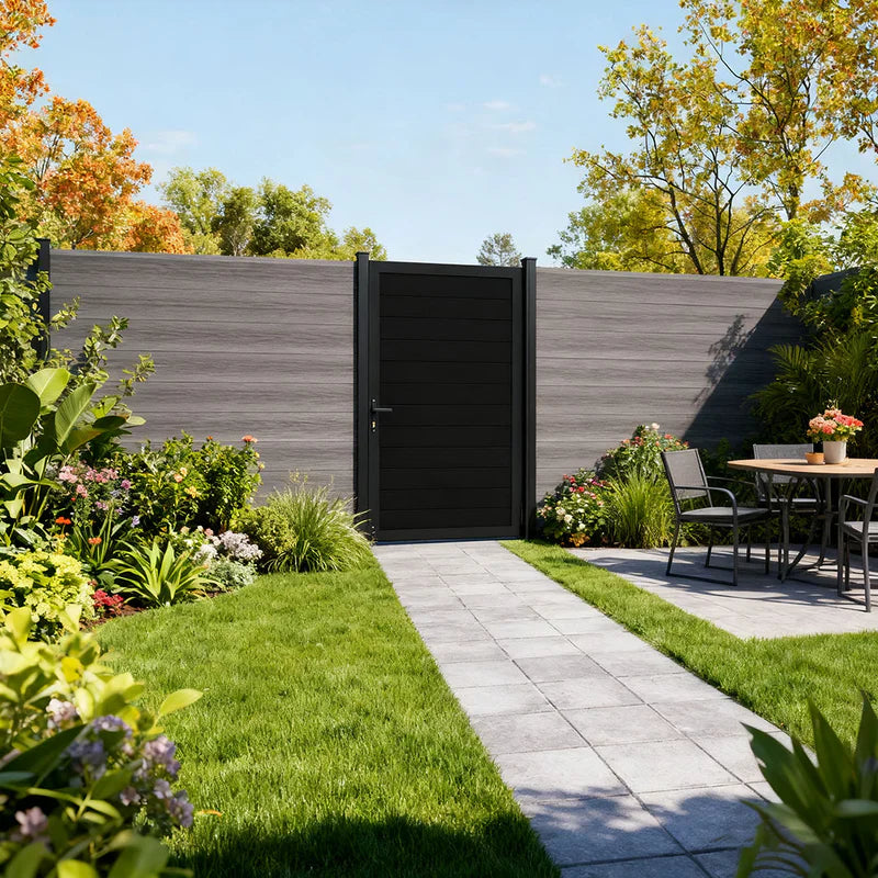 Composite fencing panels with fence gates surround a private garden.