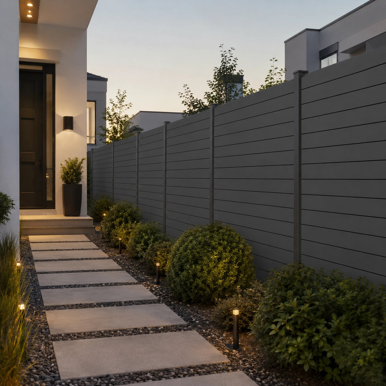 Fully privacy aluminum privacy fence along a landscaped backyard pathway